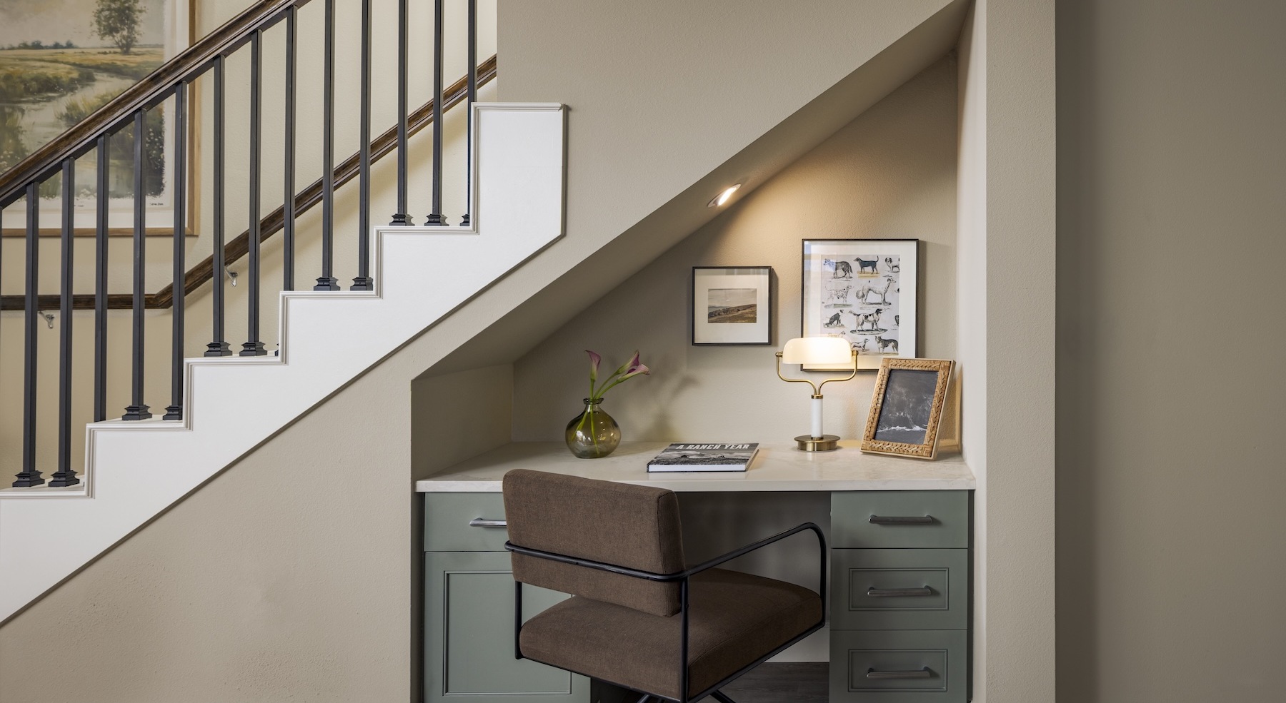 a desk under a staircase