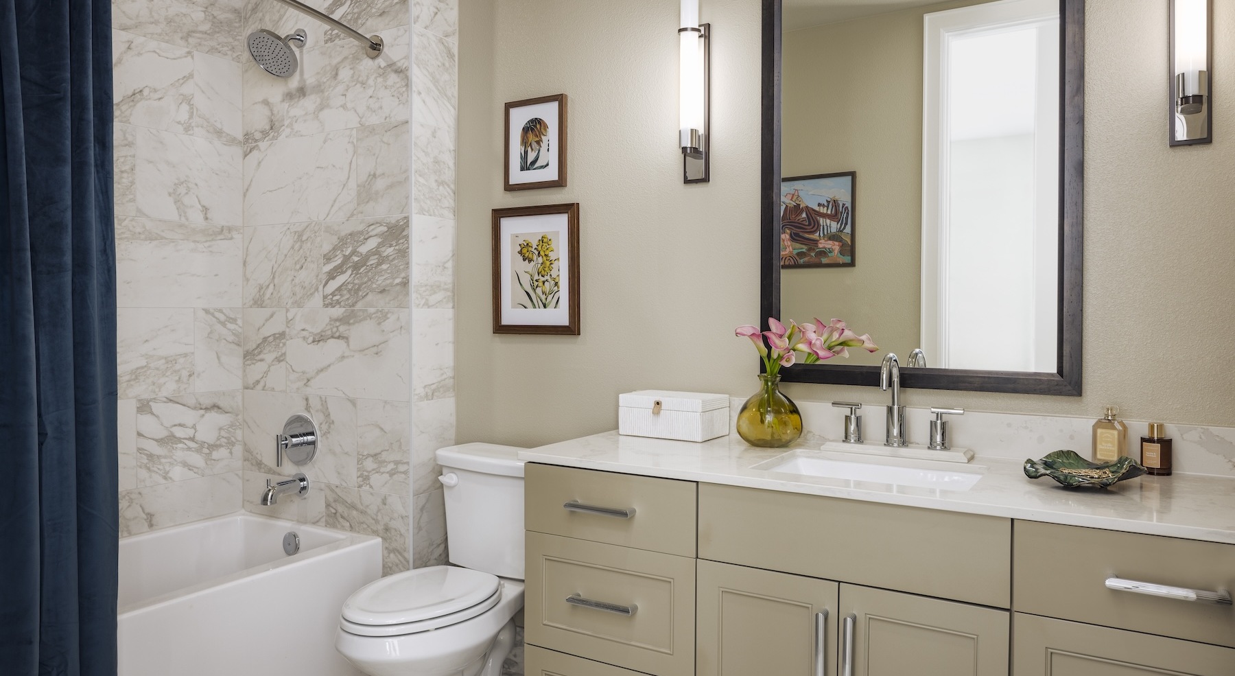 bathroom with a mirror sink toilet and tub