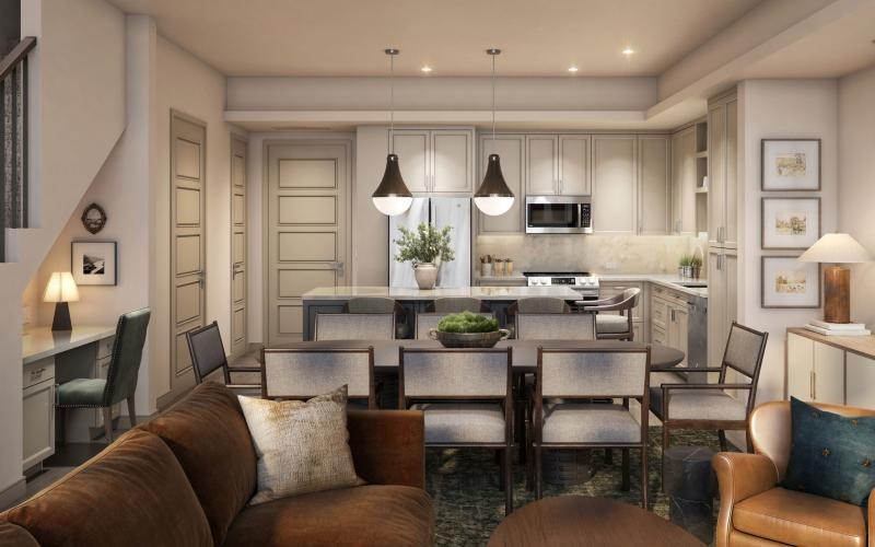 a living room with a bar and chairs