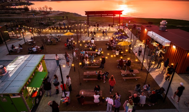 Viridian Biergarten with food trucks, picnic tables and a stage