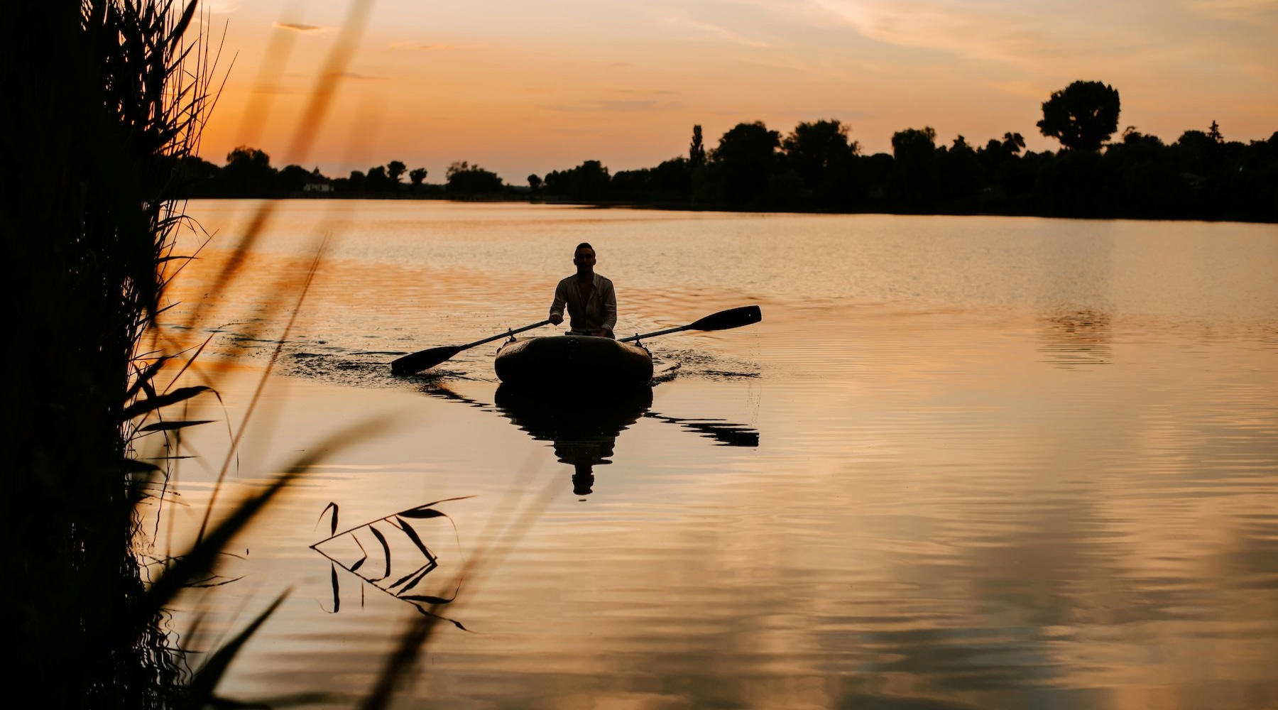 a person in a kayak at dusk